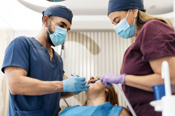 Stock photo of unrecognized woman with her mouth open during dentist revision.